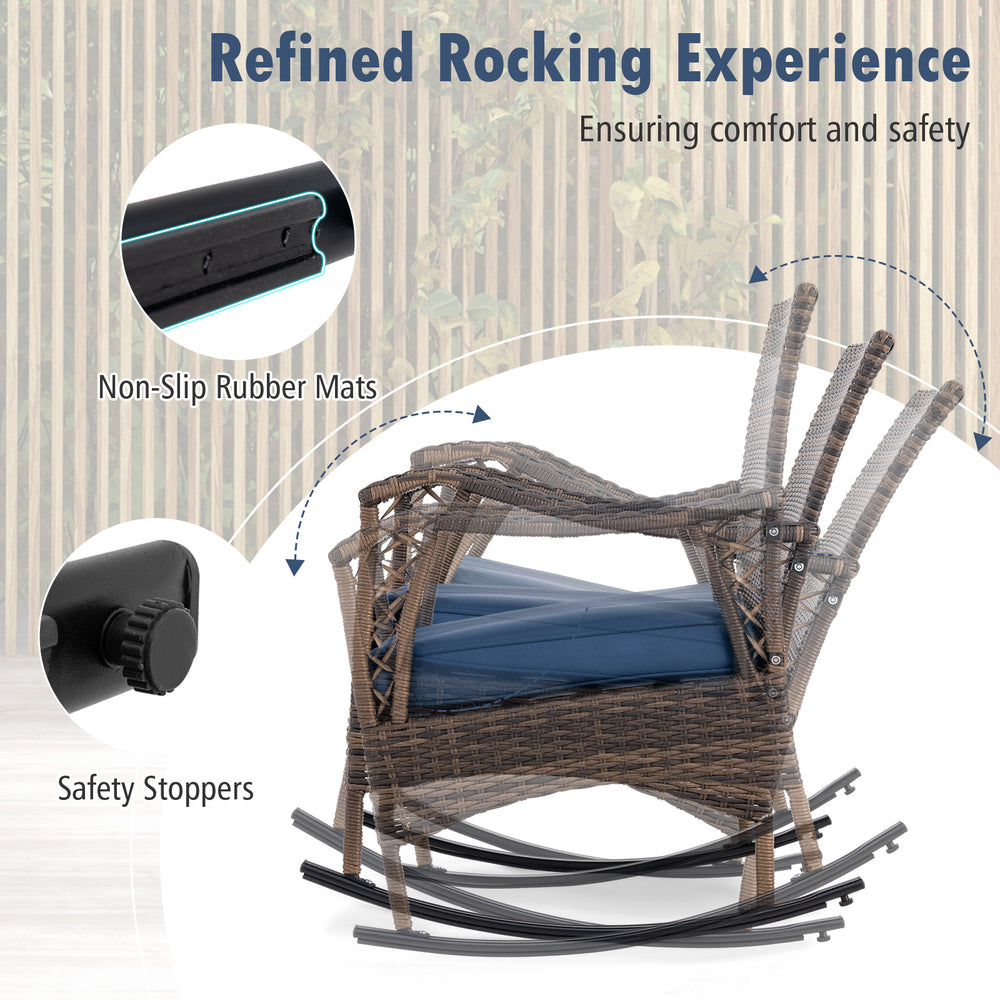 Wicker rocking chair with navy cushion, featuring non-slip mats and safety stoppers for outdoor comfort and stability.
