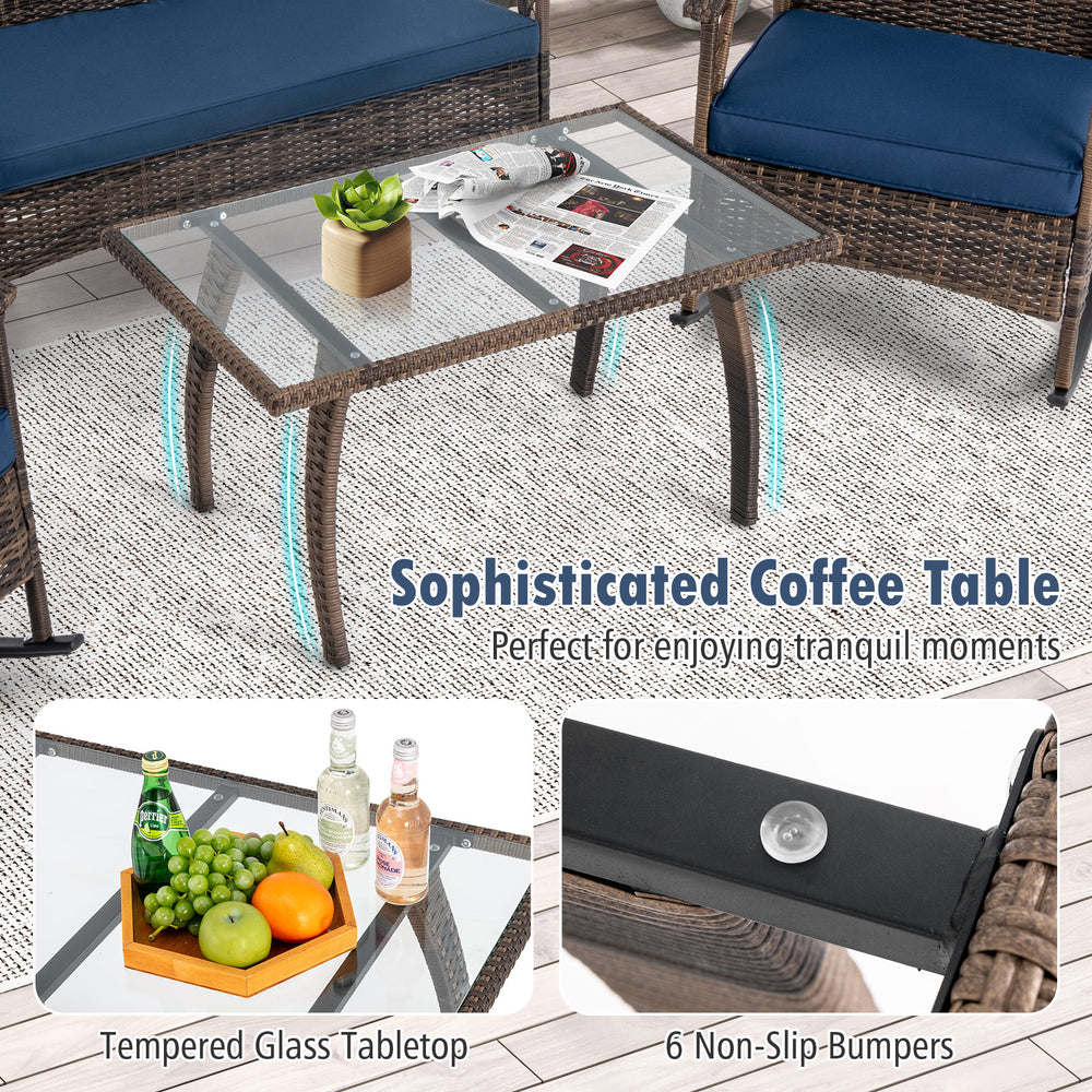 Tempered glass coffee table with PE rattan frame and non-slip bumpers, perfect for backyard relaxation.