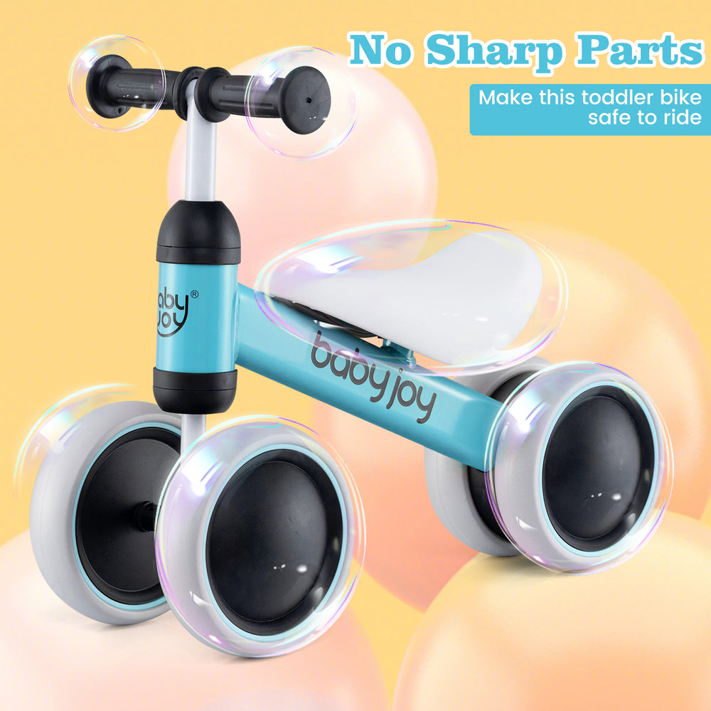 Toddler balance bike in blue with 4 wheels, soft seat, and anti-slip handlebars for safe indoor and outdoor riding.