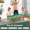 Kids playing on a 4-in-1 combo game table set featuring billiards, foosball, and hockey for family fun.