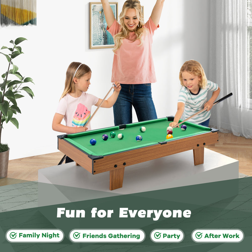 Kids playing on a 4-in-1 combo game table set featuring billiards, foosball, and hockey for family fun.