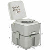 Portable 5.3-gallon travel toilet with piston pump flush, rugged design, ideal for camping and outdoor activities.