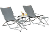 Two gray folding lounge chairs with footrests and a coffee table, perfect for patio or poolside relaxation.