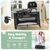 Portable baby playard in black with removable cradle, storage basket, and wheels for easy mobility and transport.