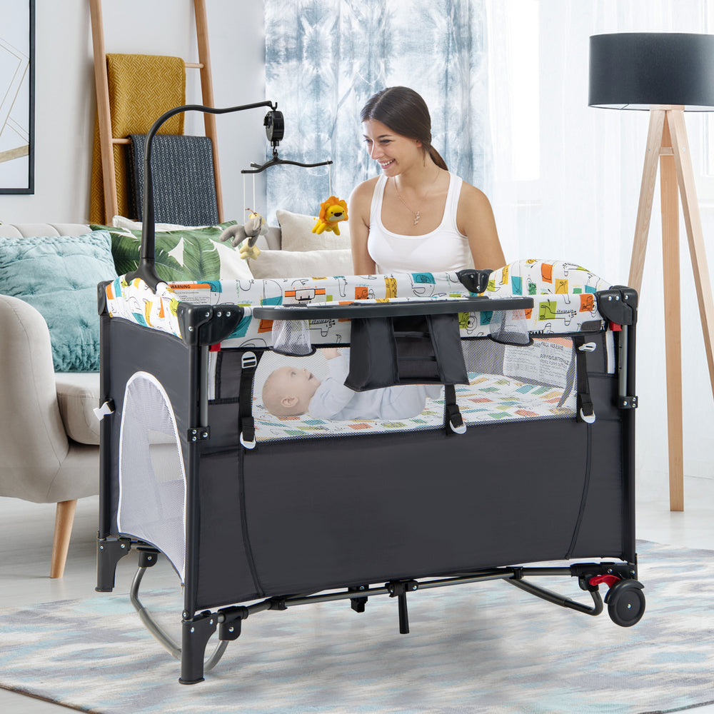 5-in-1 gray baby nursery center with detachable changing table, music box, and storage tray for versatile use.