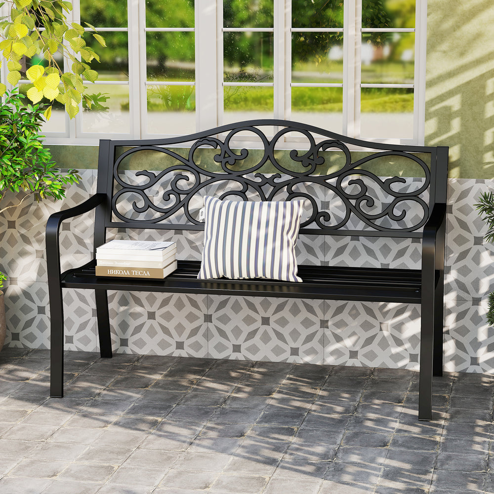 Black 50-inch outdoor garden bench with floral design backrest, slatted seat, ideal for patio or garden gatherings.