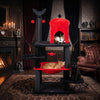 Gothic multi-level cat tree in black and red with a castle house, hammock, and spider toy for playful cats.