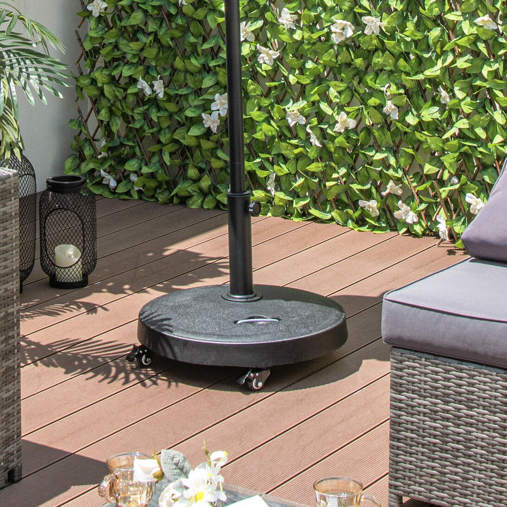 Outdoor umbrella base with wheels, made of high-strength resin, features a rustproof metal pole and retractable handles.