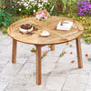 Round 53-inch outdoor acacia wood dining table for 4-6 people, featuring a slatted top and integrated umbrella hole.