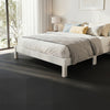 EVA foam floor tiles in black provide non-slip comfort and protection, ideal for home gym or living room use.