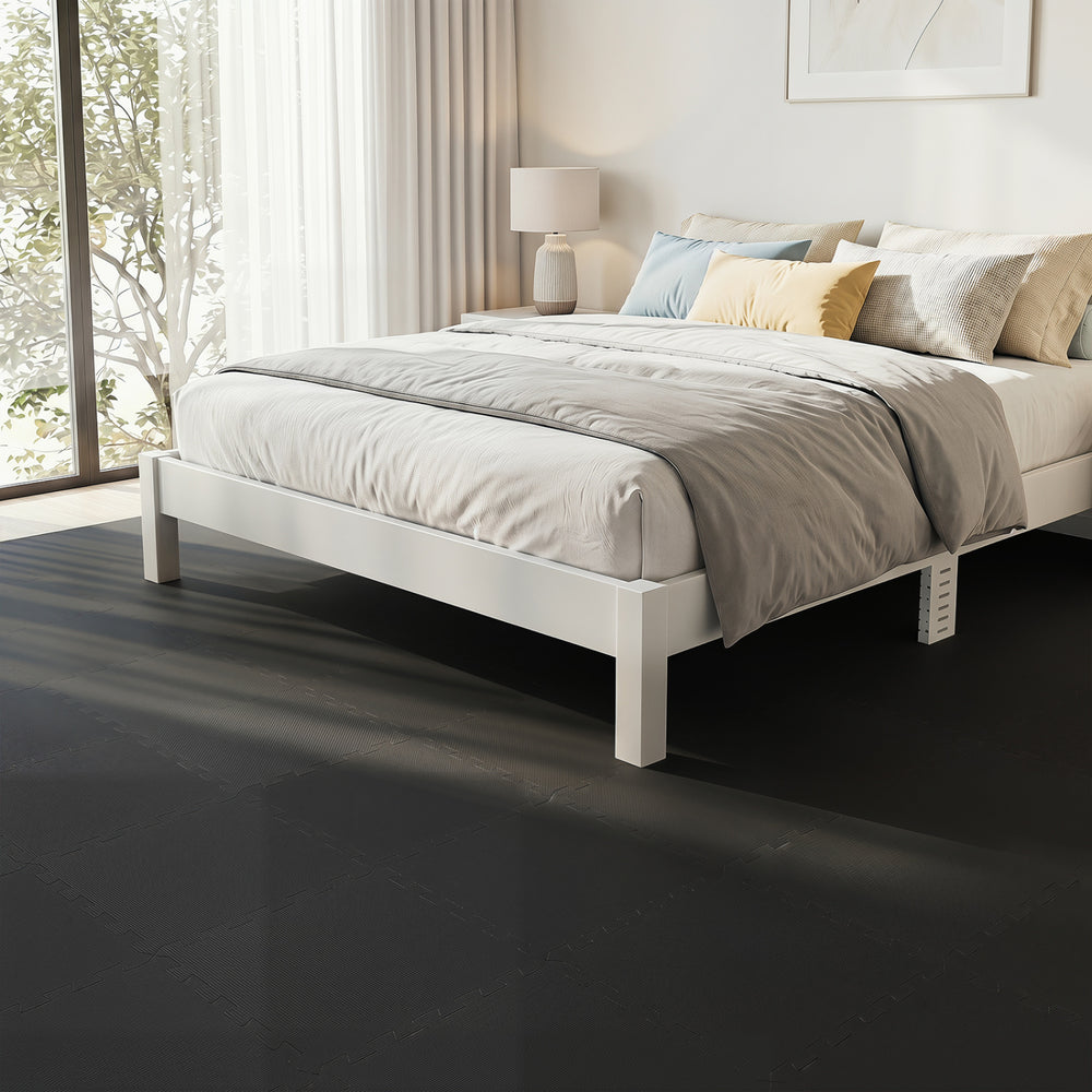 EVA foam floor tiles in black provide non-slip comfort and protection, ideal for home gym or living room use.
