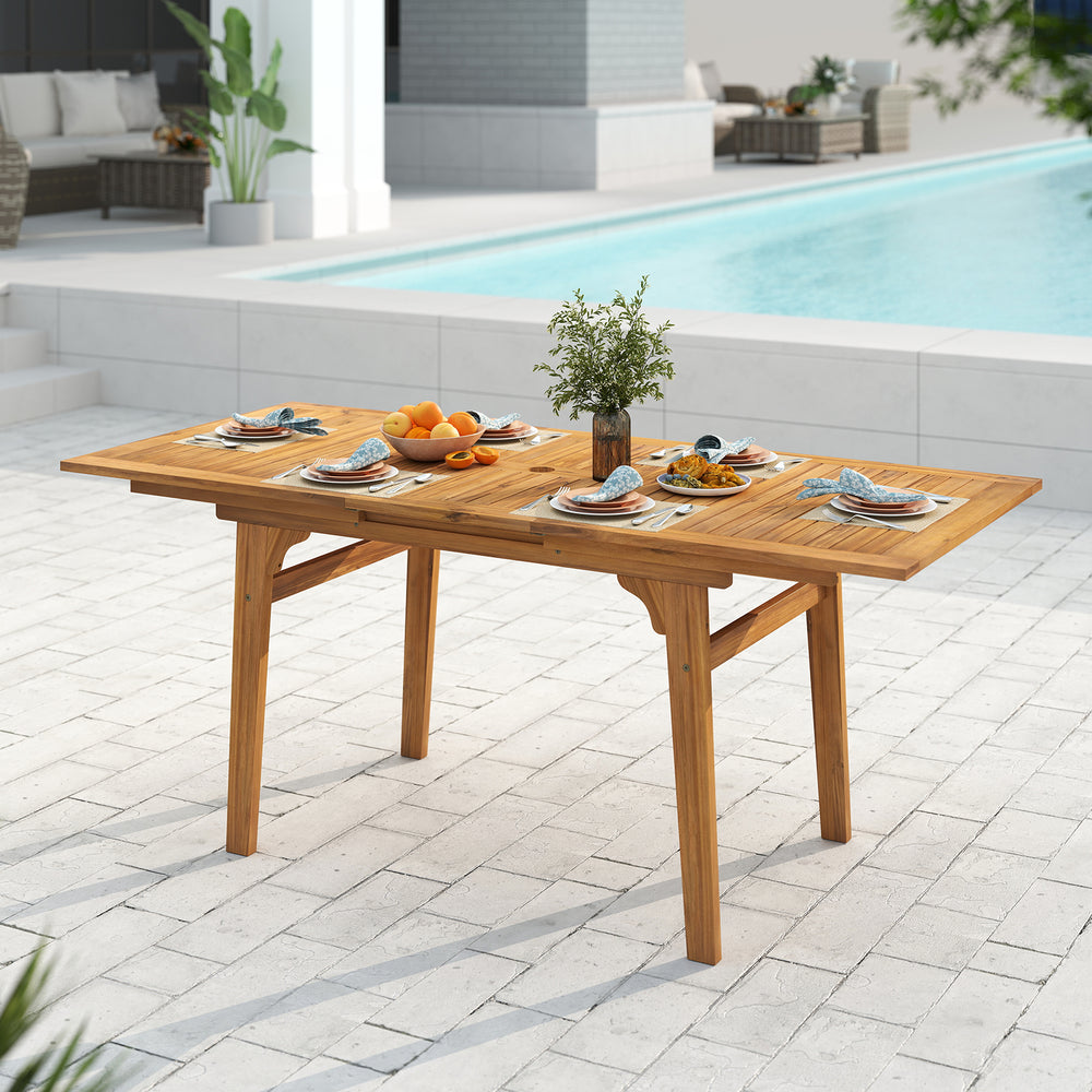 Expandable patio dining table made of solid acacia wood, showcasing a smooth splinter-free surface, suitable for.