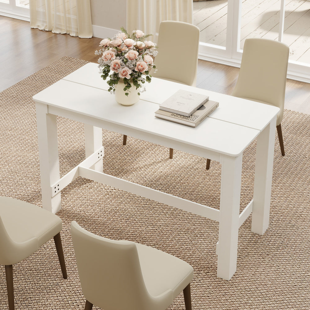 White 55-inch wooden dining table with rounded corners, seating 4-6, ideal for dining rooms or kitchens.