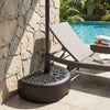 Half-round black patio umbrella base with floral design, holds 55 lbs for stability, ideal for poolside or deck use.