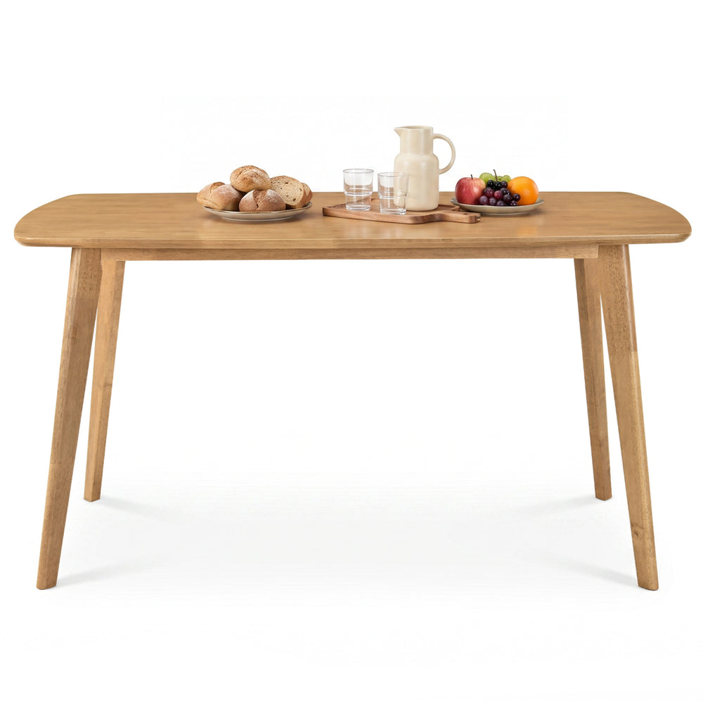 Natural rubber wood dining table, featuring smooth rounded edges, comfortably seats 4-6 people for family meals and gatherings.