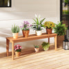 Teak wood outdoor bench with plants on top, featuring a solid construction and 880 lbs weight capacity for patio use.