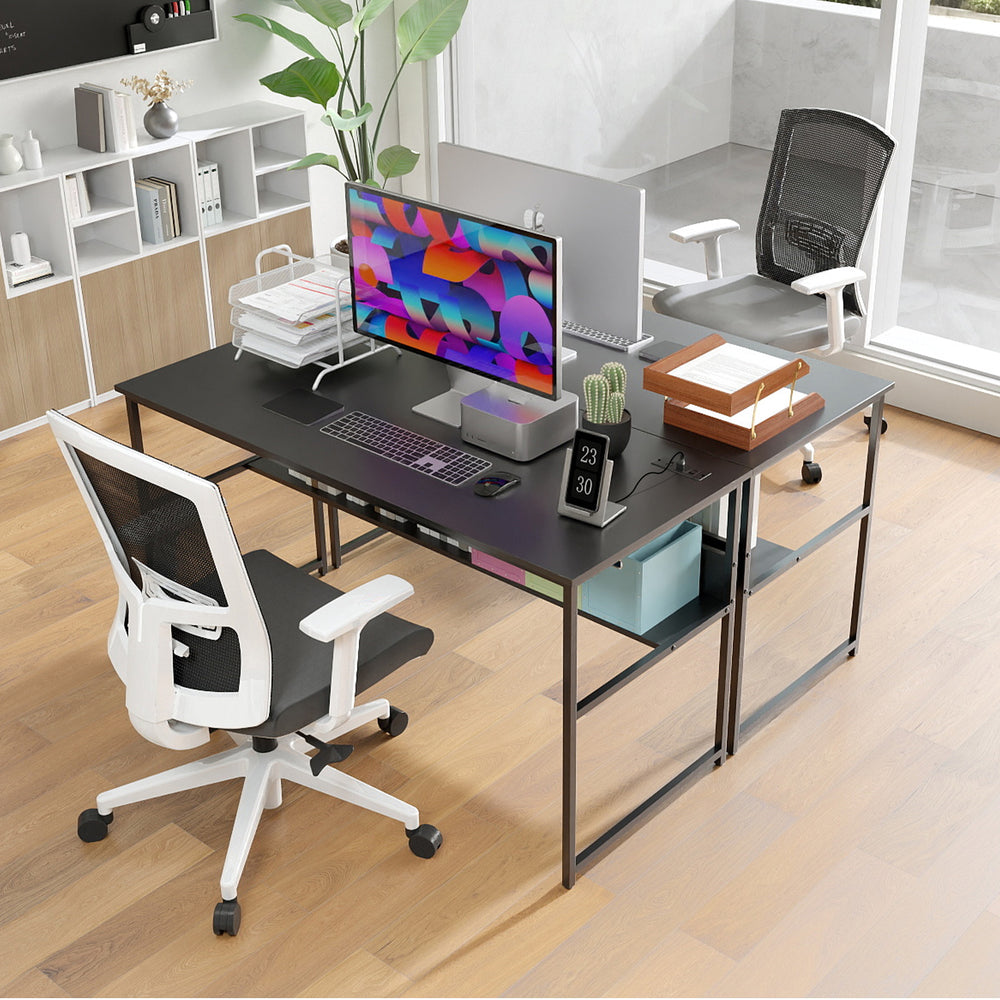 Black 55 x 24 inch computer desk with built-in power outlets, spacious surface, and under-desk storage for office.