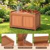 52-gallon patio wood deck box with flip top, ideal for cushions and gardening tools, shown in a garden setting.