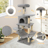 Multi-level light gray cat tree with padded top perch, sisal scratching posts, and hanging balls for interactive play.
