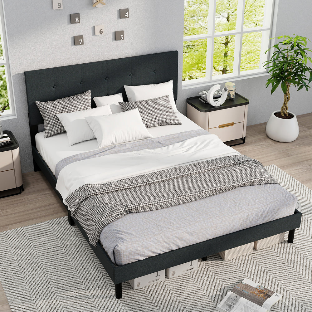 Queen size upholstered bed frame in dark gray with tufted headboard, featuring sturdy wooden slats and ample under-bed.