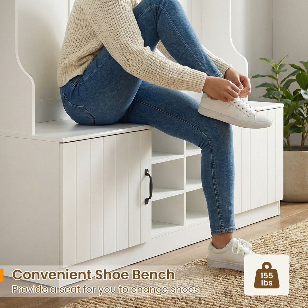 Shoe bench with a person sitting, featuring white wooden construction and cubbies for organized storage. Perfect for.