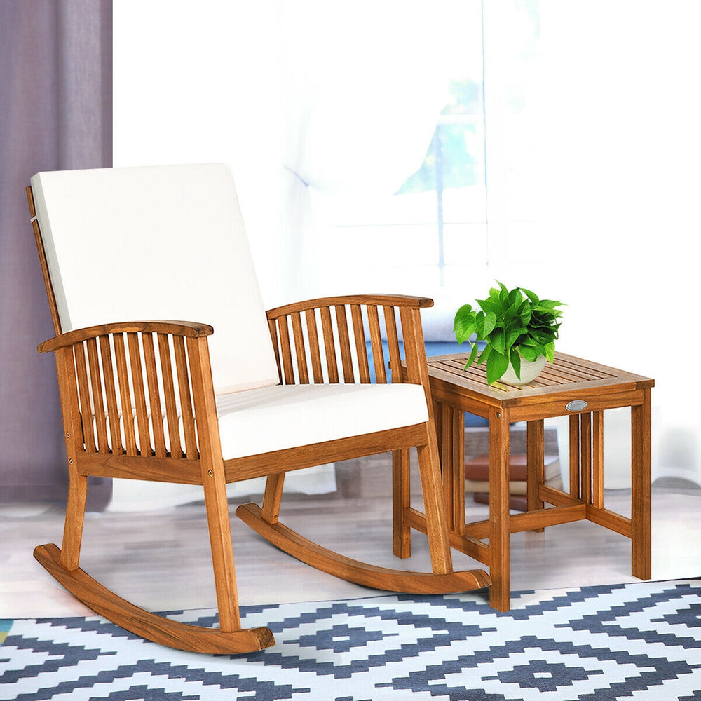 Acacia wood rocking chair and table set with thick cushions, perfect for indoor or outdoor relaxation.