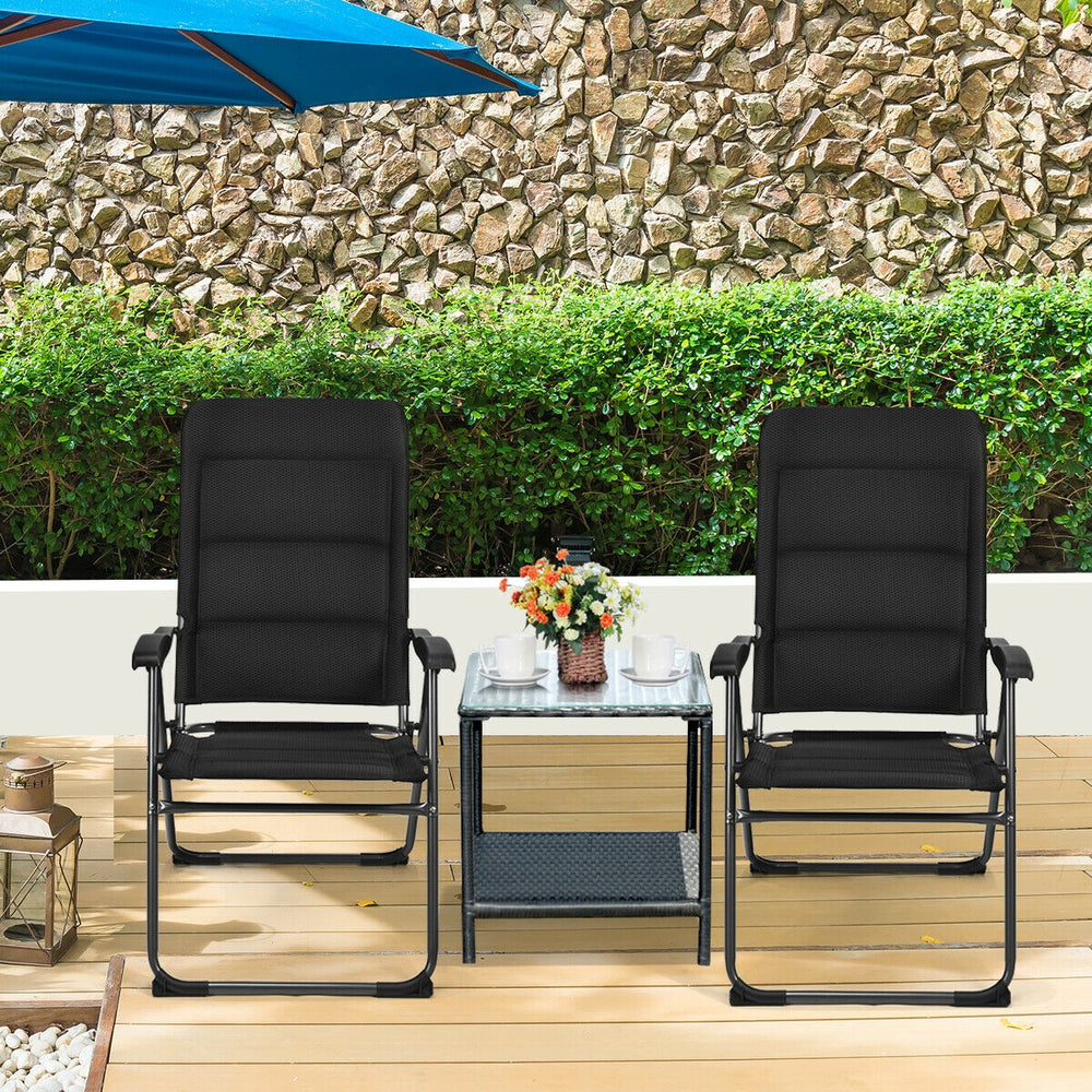 Two black outdoor folding patio chairs with adjustable backrests, perfect for bistro or backyard relaxation.
