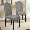 Single gray tufted upholstered dining chair featuring a high curved backrest and elegant rivet design, perfect for.