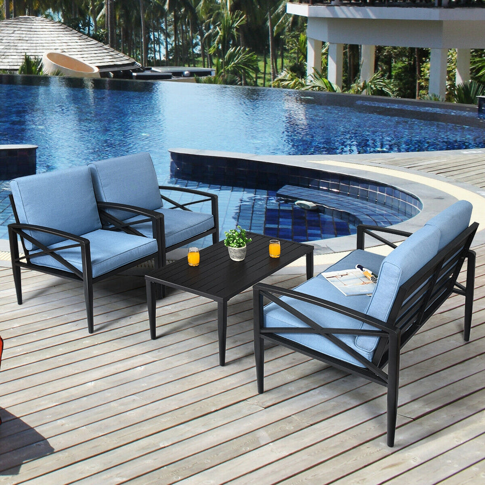 Patio furniture set featuring two cushioned sofas and a side table with a black aluminum frame, perfect for outdoor.