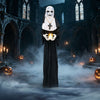 Life-size animated nun Halloween decoration stands menacingly with a flickering candle, enhancing eerie settings for Halloween.