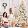 6 feet hinged unlit artificial silver tinsel Christmas tree with 1036 branch tips, perfect for festive indoor.