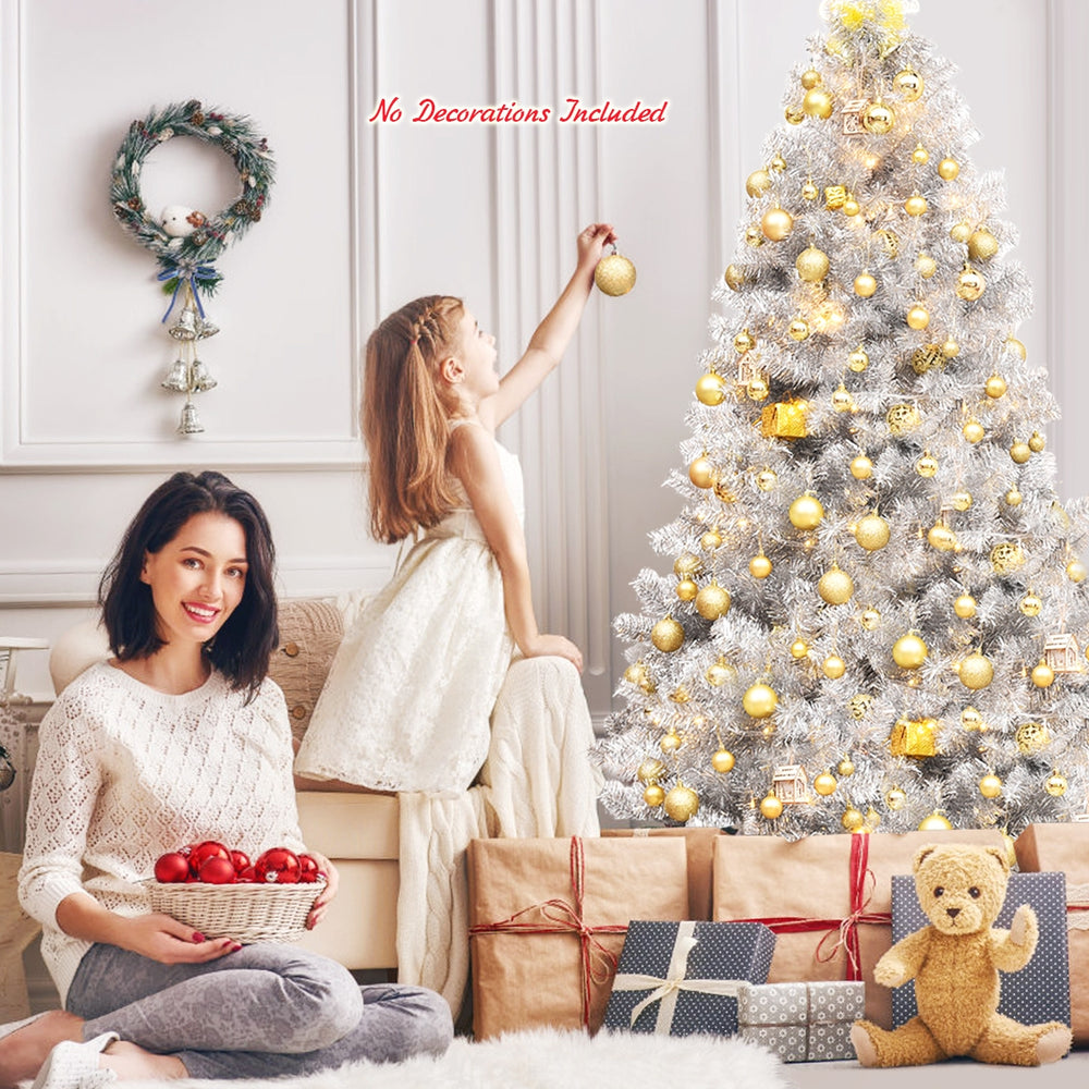 6 feet hinged unlit artificial silver tinsel Christmas tree with 1036 branch tips, perfect for festive indoor.