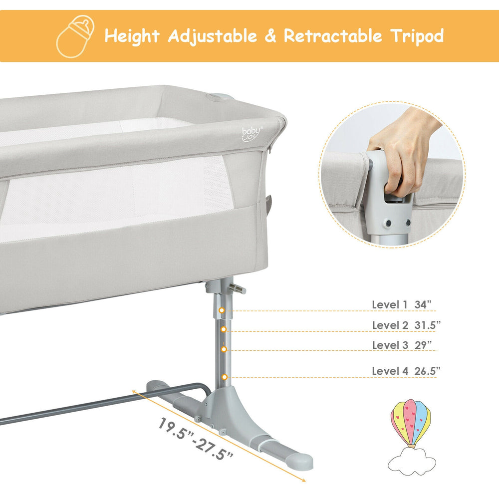 Height adjustable portable baby bed side sleeper in beige with detachable sidebar for easy parent interaction.