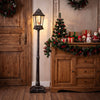 Black 5.4 ft musical Christmas street lamp with dynamic snowfall effect, shown upright in a festive indoor display.
