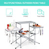 Foldable outdoor BBQ table with heat-resistant aluminum countertop, four hooks, and side shelves for camping and.