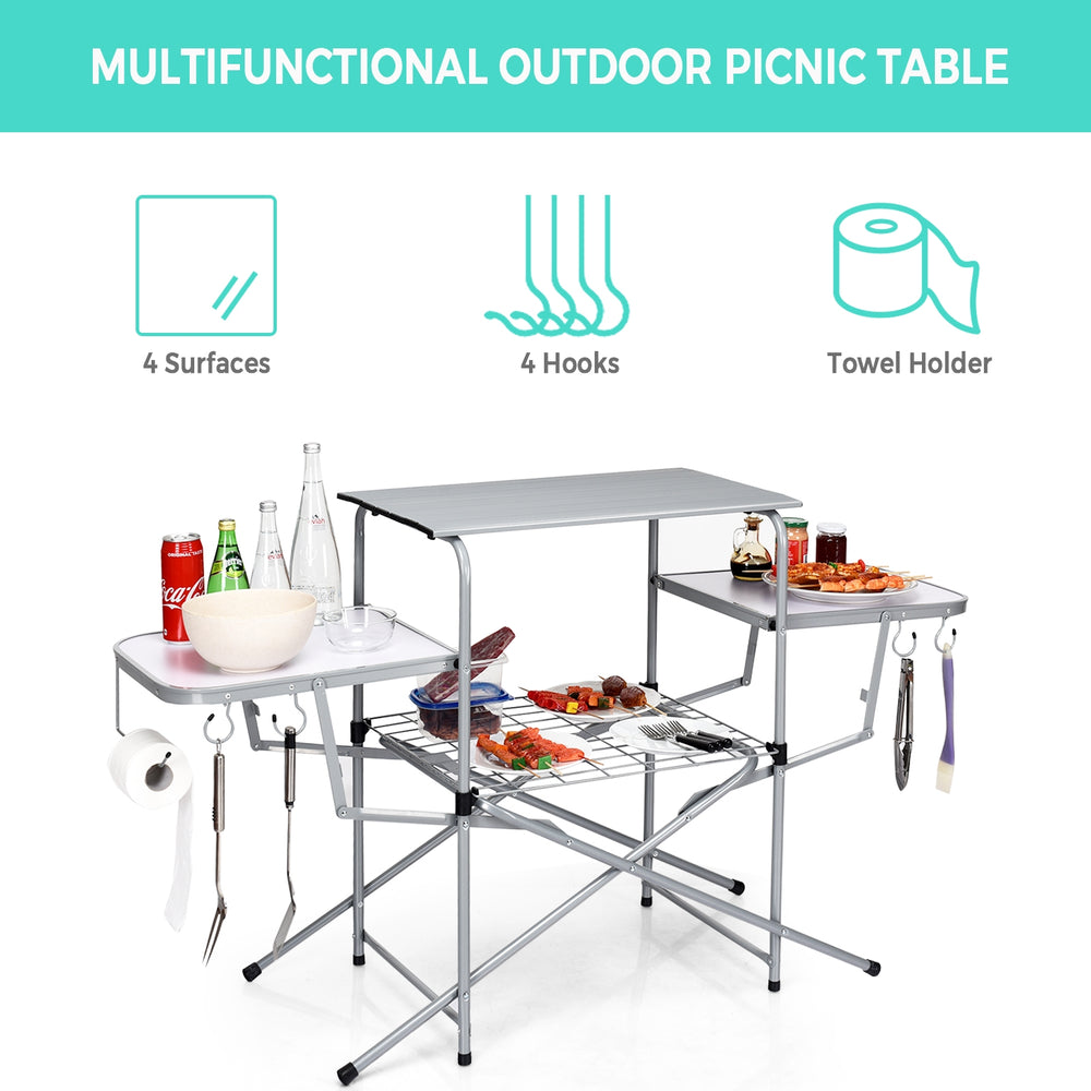 Foldable outdoor BBQ table with heat-resistant aluminum countertop, four hooks, and side shelves for camping and.