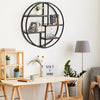 Circular wall-mounted 4-tier rack in black metal, ideal for displaying plants and decor in modern minimalist spaces.