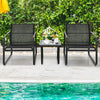 Two ergonomic black patio chairs with a glass top table, perfect for outdoor relaxation by the poolside.