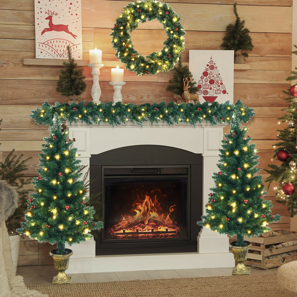 Entrance tree with thick branches and pre-lit LED lights, accented with red berries for vibrant Christmas decor.