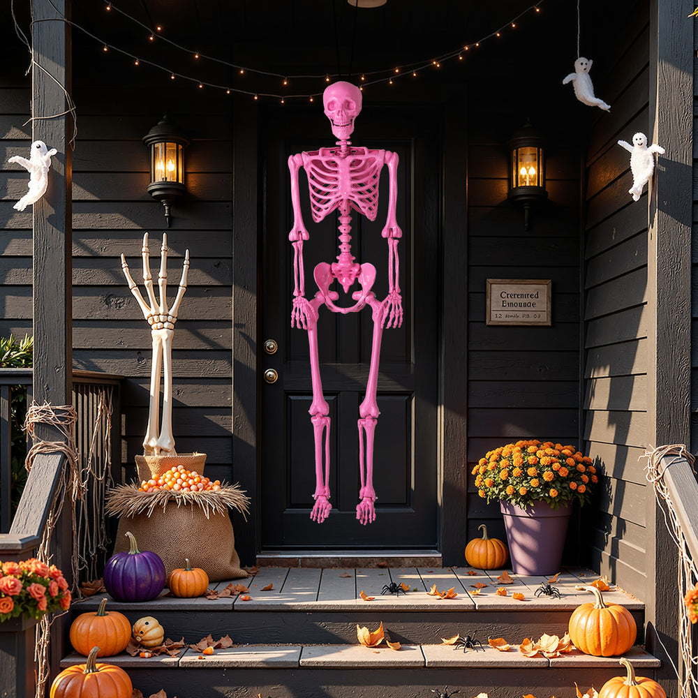 Pink life-size Halloween skeleton with movable joints, displayed on a porch, enhances outdoor festive decorations.