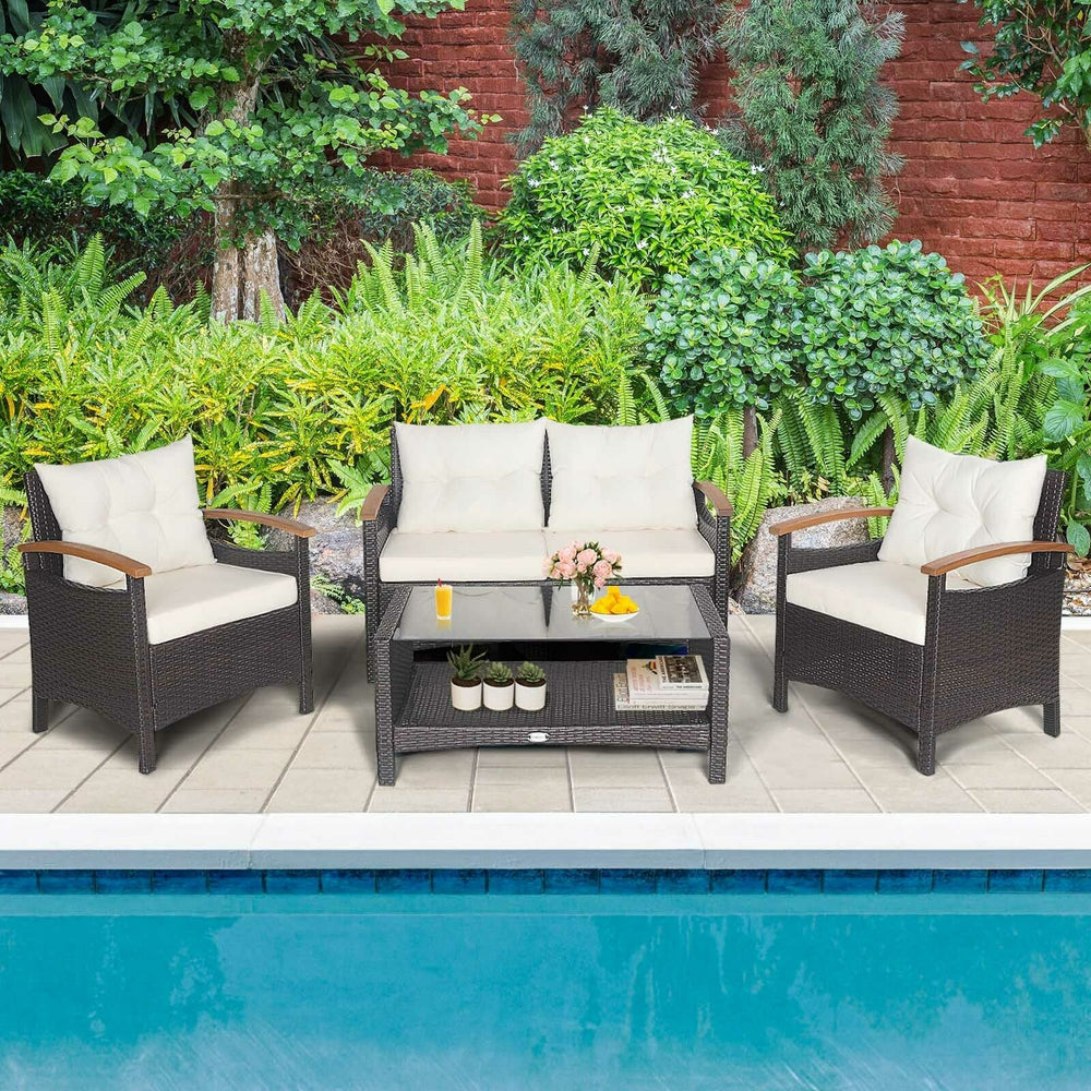 4-piece patio rattan furniture set with cushioned sofa and storage table, perfect for outdoor relaxation by the.