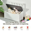 Kids wooden storage bench with safety hinge, perfect for organizing toys and clothes in a playroom or bedroom.