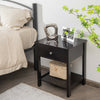 Black wooden storage shelf with drawer, featuring a wide tabletop and bottom shelf, perfect for bedroom or living room.