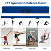 7FT blue folding balance beam with handles, featuring a wood core and foam top for safe gymnastic training at home.