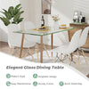 Modern glass rectangular dining table with sturdy metal legs, perfect for home or office use, featuring a clear.