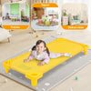 Colorful stackable naptime cot with a child lying on it, ideal for preschools and daycares, featuring a durable design.