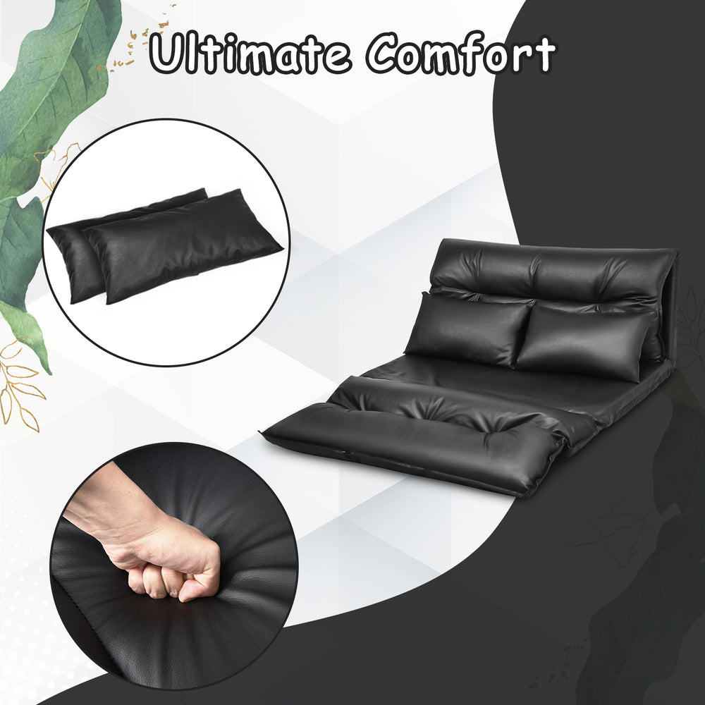 Foldable PU leather leisure floor sofa bed in black with two pillows, adjustable for lounging or sleeping in small.