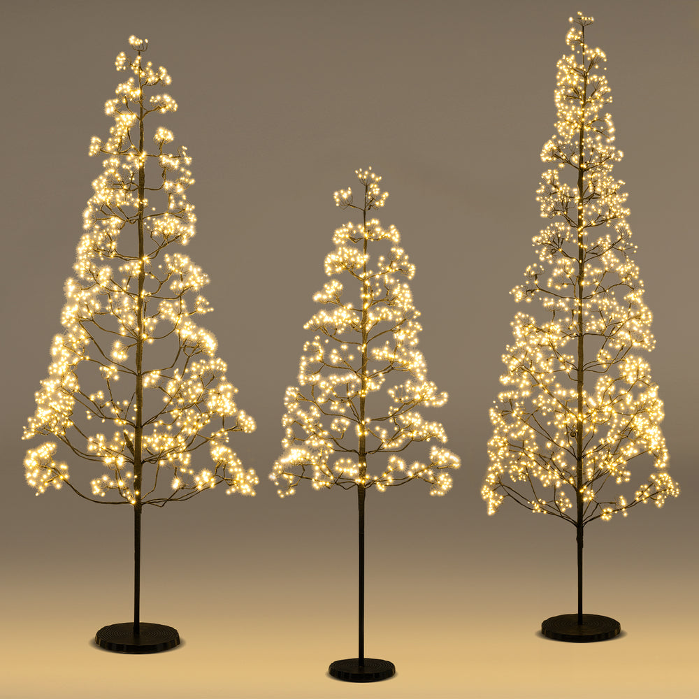 Lighted alpine tree set featuring 5ft, 6ft, and 7ft heights with warm white LED lights for versatile holiday decor.