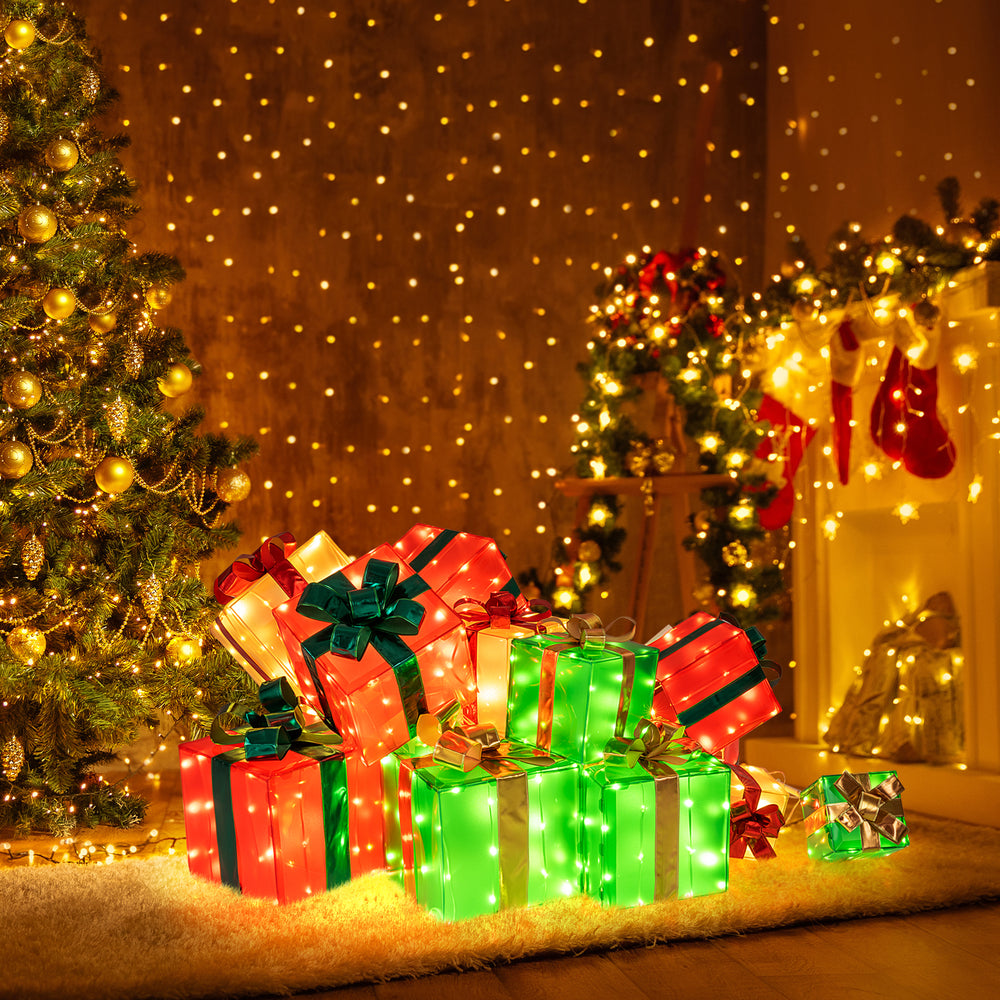 Colorful lighted Christmas boxes with bows, featuring 483 LED lights, perfect for festive indoor or outdoor decoration.