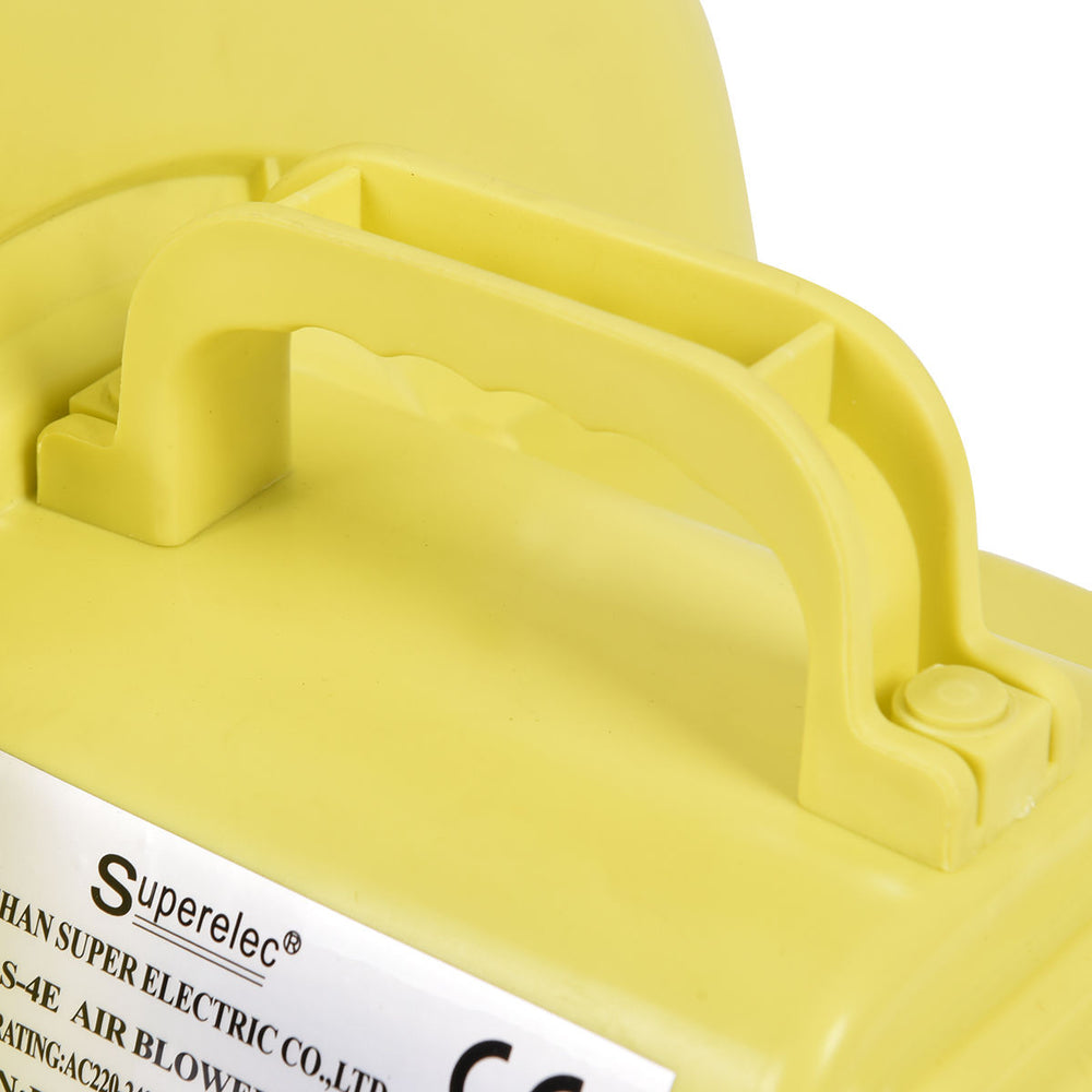 Top-mounted handle of the 480 W air blower pump for inflatable bounce houses, designed for easy transport and use.